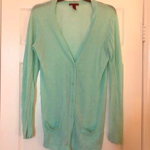 Buckle teal long sweater with pockets.